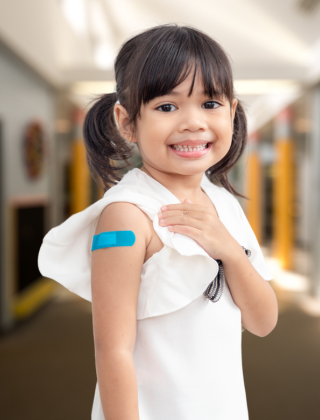  young girl with bandaid on arm 